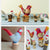 Collage of wooden bird figurines on stands with a neutral background