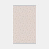 Floral patterned towel on a light pink background
