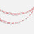 A festive red and white striped paper garland made of linked loops, draped in two curved rows against a plain light gray background.