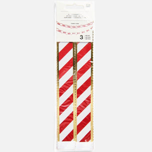 Three rolls of candy cane garland with red and white diagonal stripes and gold edges, packaged in a clear plastic sleeve with a white header card.