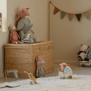 Children's room with toys and a wicker basket