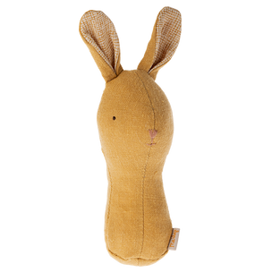Yellow plush bunny toy with checkered ears on a white background
