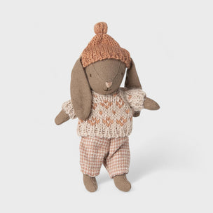 Maileg rabbit toy wearing a knitted sweater and hat on a white background