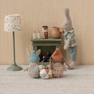 Maileg Set of toy animals with a small table and lamp in a room setting