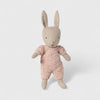 Maileg rabbit toy wearing a pink outfit on a white background