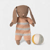Maileg toy rabbit with a striped outfit and a ball on a white background