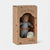 Maileg rabbit toy in a cardboard box with 'Maileg' branding on a white background