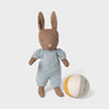 Mailg  rabbit toy in a knitted outfit with a ball on a light gray background