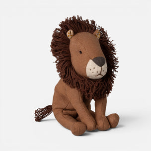 A plush Maileg lion toy sitting down, featuring a medium brown body, a dark brown shaggy mane, and a cream-colored snout and nose.