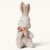 maileg bunny toy with a pink bow on a white background