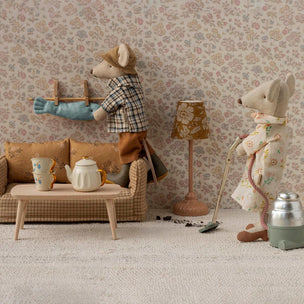 Maileg Two toy mice in a room with furniture and decor, including a lamp and a teapot.