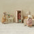Maileg Miniature scene with toy mice in a room setting, including a wardrobe and furniture.