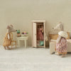 Maileg Miniature scene with toy mice in a room setting, including a wardrobe and furniture.
