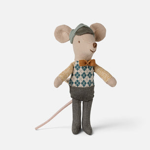 A Maileg mouse doll dressed in vintage clothing, featuring a blue and white argyle vest, yellow checkered sleeves, gray trousers, and a green cap, set against a plain light gray background.