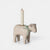 Wooden sheep-shaped candle holder with a candle on a white background