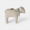 Wooden sheep-shaped candle holder with a green ribbon on a white background