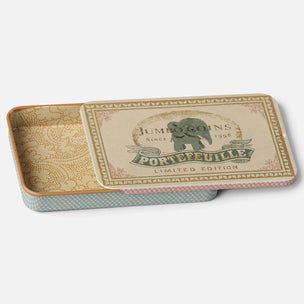 A decorative Maileg ectangular metal tin with its lid resting on top, shown on a light gray background. The tin features vintage-style artwork with an elephant logo reading 'Jumbo Coins Since 1998 Portefeuille Limited Edition' on the lid, a beige patterned interior, and a blue-and-white patterned side edge.