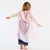 Child with pink play silks
