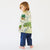 Child wrapped in a map-themed blanket on a white background