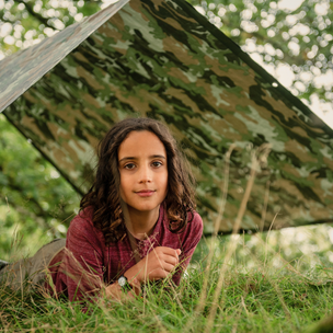 kid under tarpaulin 