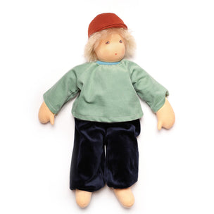 waldorf doll with blond hair, wearing hat on white back ground