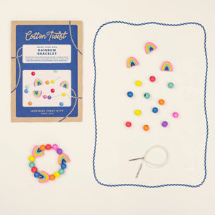 Rainbow bracelet kit with packaging and materials on a white background