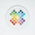Colorful round candies on a white plate with a white background