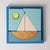 Grimm's Wooden puzzle with geometric shapes in a blue box on a light gray background