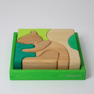 Grimm's Wooden puzzle of a squirrel in a green box on a white background