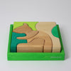 Grimm's Wooden puzzle of a squirrel in a green box on a white background