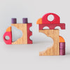 Grimm's Colorful wooden building blocks on a light gray background