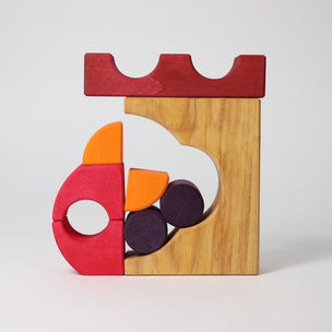 Grimm's Wooden puzzle with colorful geometric pieces on a white background