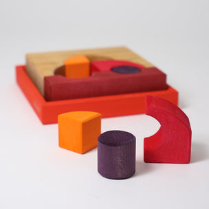 Colorful wooden geometric shapes on a white background