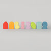Grimm's Set of colorful, abstract wooden blocks on a light gray background