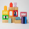 Grimm's Colorful wooden blocks with various shapes on a light gray background