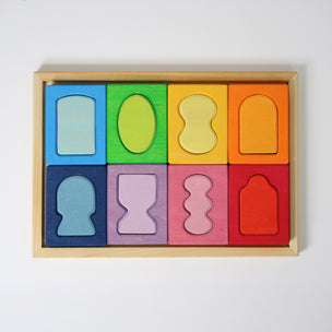 Grimm's Colorful wooden shape sorting puzzle in a box on a white background