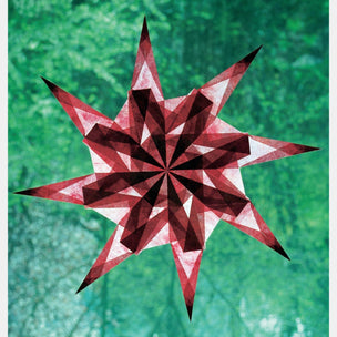 Red and white geometric star design on a green textured background