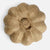 A single flower-shaped textured object made of natural brown paper or cardboard, photographed from above on a plain white background.