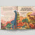 Open book with colorful dinosaur illustrations and text on a light gray background