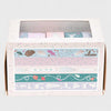 Set of washi tape rolls in a decorative box on a white background