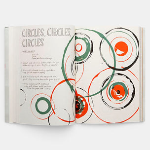 Open book with circular art and text on a white background
