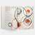 Open book with circular art and text on a white background