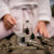 Person holding small glass cases with insects on a natural background