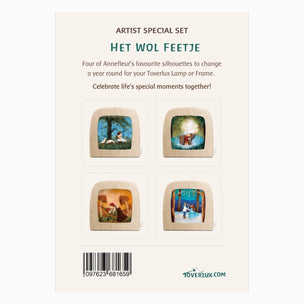Back of a product card for the 'Het Wol Feetje' artist special set by Toverlux, showing four square wooden lamp bases with colorful illustrated silhouettes of animals and nature scenes, plus text and a barcode.