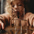 Child playing with  spider specimens on clear blocks