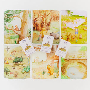 Winnie -the -Pooh Set of fabric panels with illustrated scenes and characters, resembling children's book illustrations.