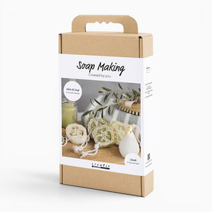 Soap making kit packaging with natural elements on a white background