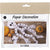 Package of paper decoration kit with skeleton design on a wooden surface