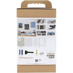 Cardboard box with printed content and tools on a white background