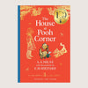 Book cover of 'The House at Pooh Corner' with illustrations of a child, Pooh bear, and Tiger on a red background.